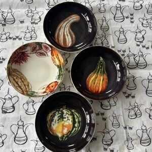 Williams Sonoma squash /fall bowls and matching cup. Squash on black background